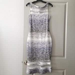 Midi length bodycon mesh cut out fluted dress